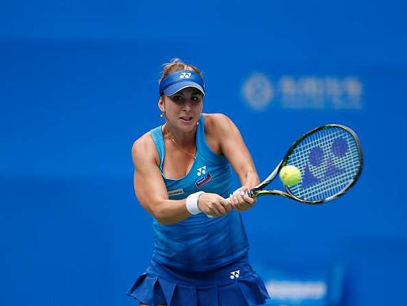 WUHAN, CHINA - SEPTEMBER 25: Belinda Bencic of Switzerland returns a shot against Svetlana Kuznetsova of Russia in a match during Day 1 of the 2016 Wuhan Open at Optics Valley International Tennis Center on September 25, 2016 in Wuhan, China. (Photo by Kevin Lee/Getty Images)